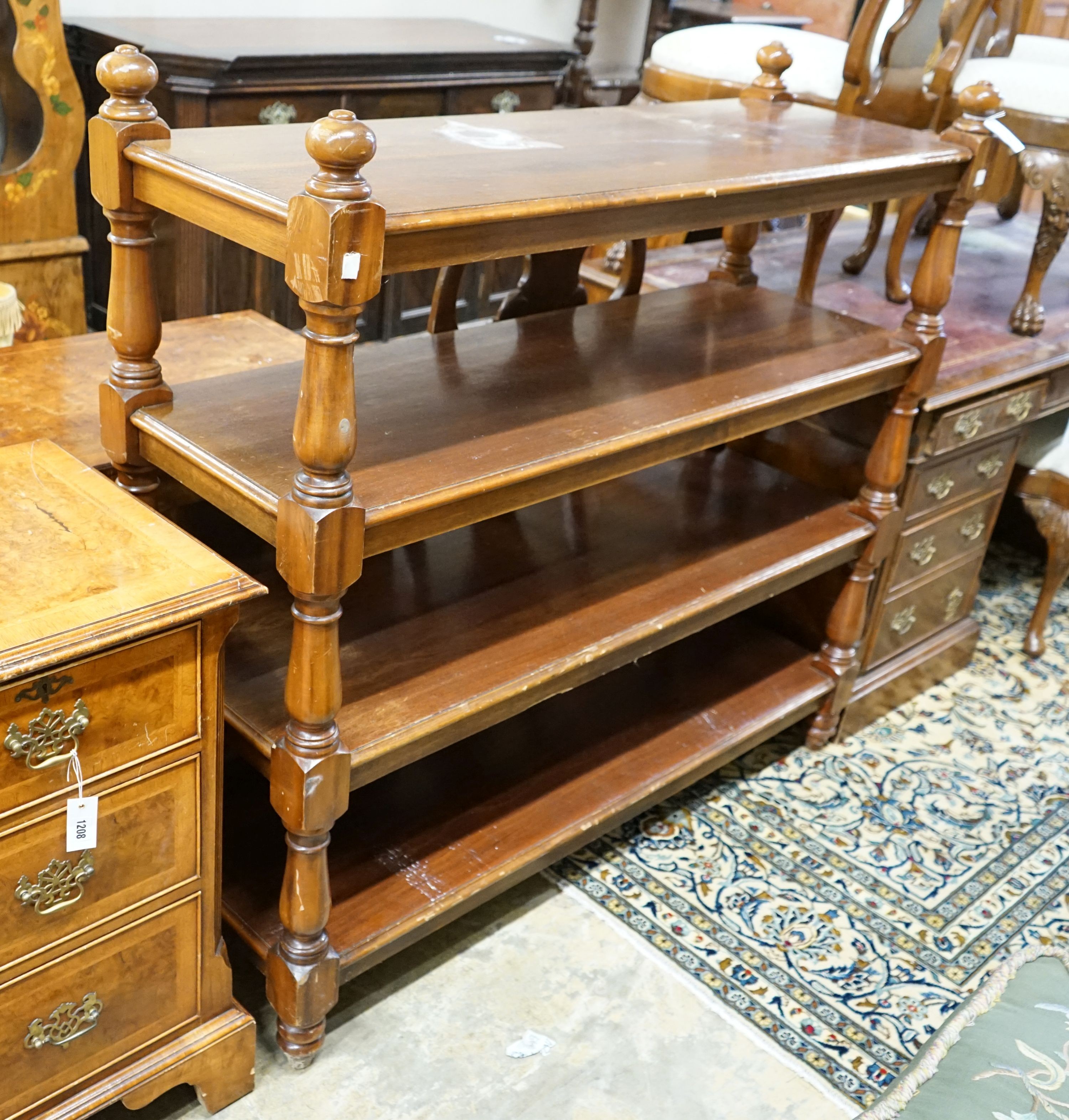 A Victorian style mahogany four tier buffet, length 136cm, depth 48cm, height 130cm